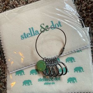 2 Stella & Dot new in package jewelry cloth cleaners and one ring sizer